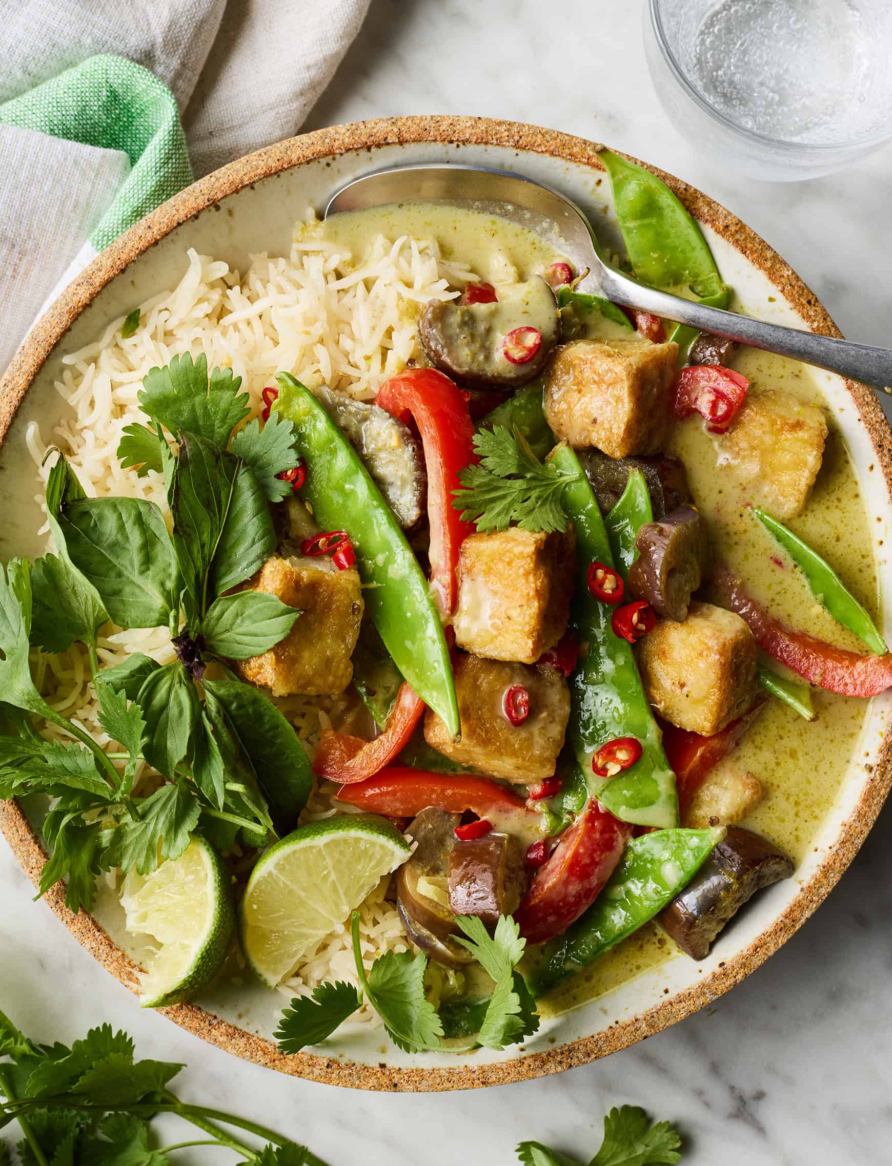 Thai green curry in bowl with rice
